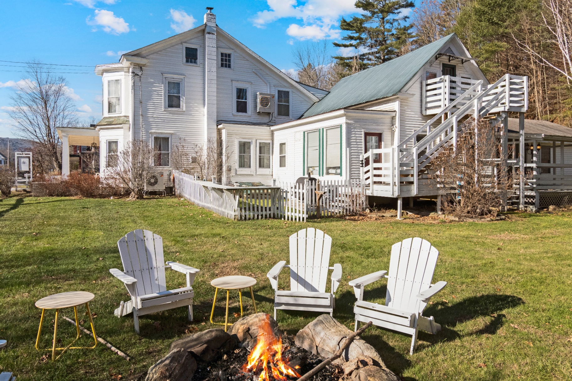Aerial view of the historic Bridgewater Living property, main house and suites surrounded by Vermont woods